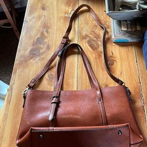 Brand unknown. Faux leather bag with tons of pockets.